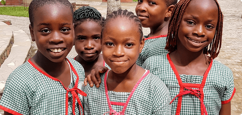 Smiling children in school uniforms